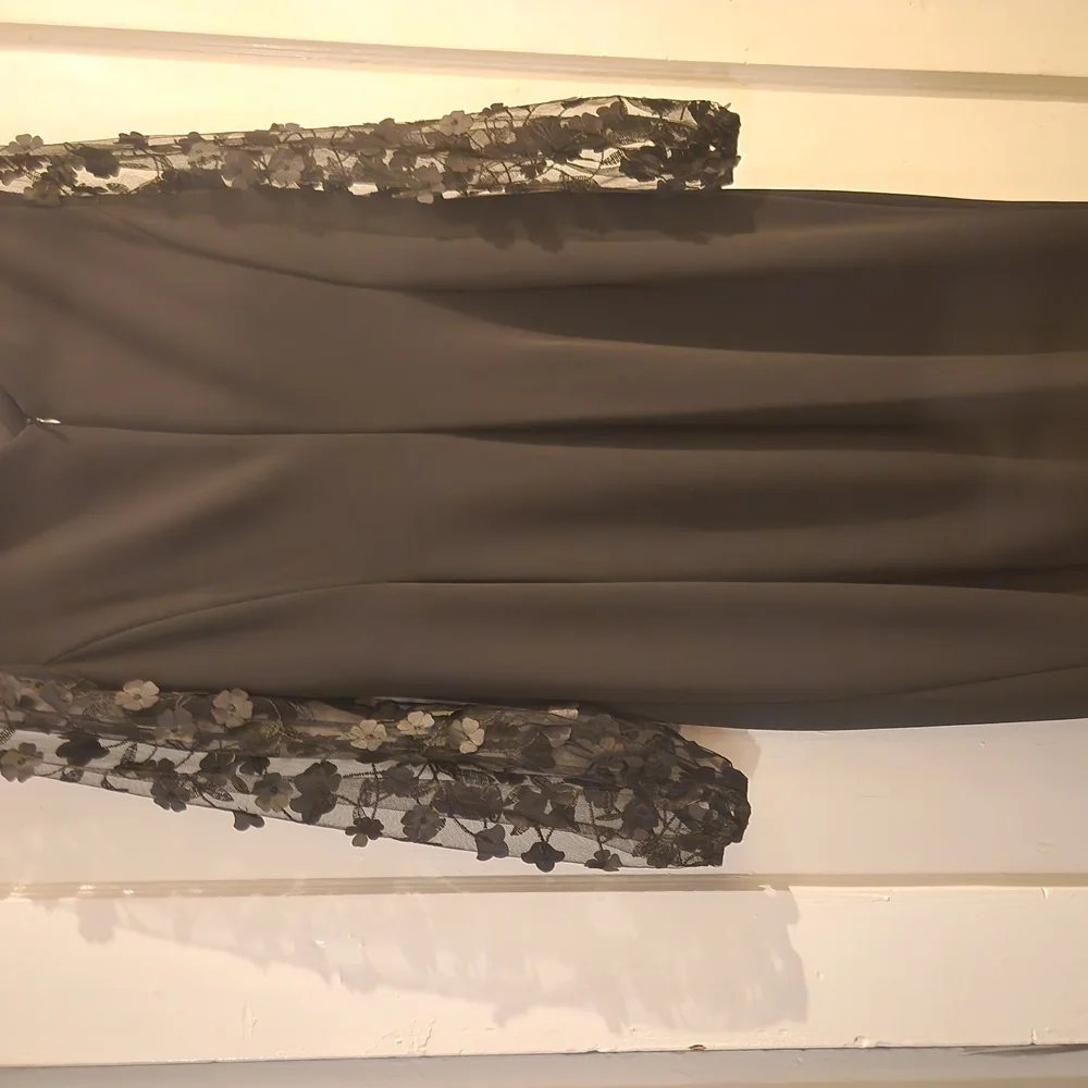 Elegant Black Dress with Floral Sleeves - Picture 2 of 12